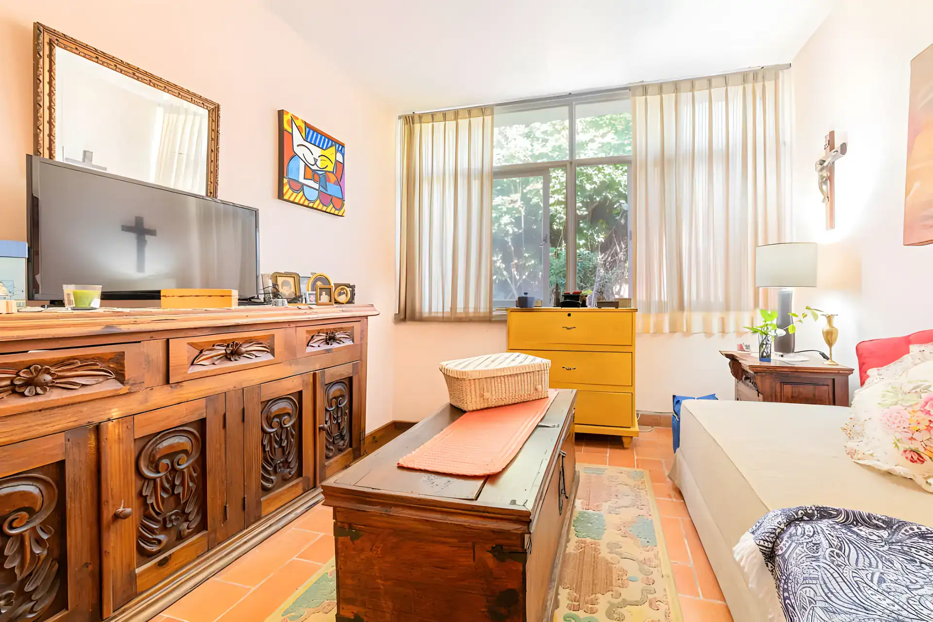 Casitas Terraplen, bedroom with a carved wood sideboard, a television and a daybed, San Miguel de Allende