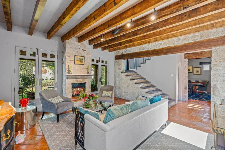 Cuesta de San Jose 22, living room with a stone staircase, a fireplace and glass doors to the garden, San Miguel de Allende
