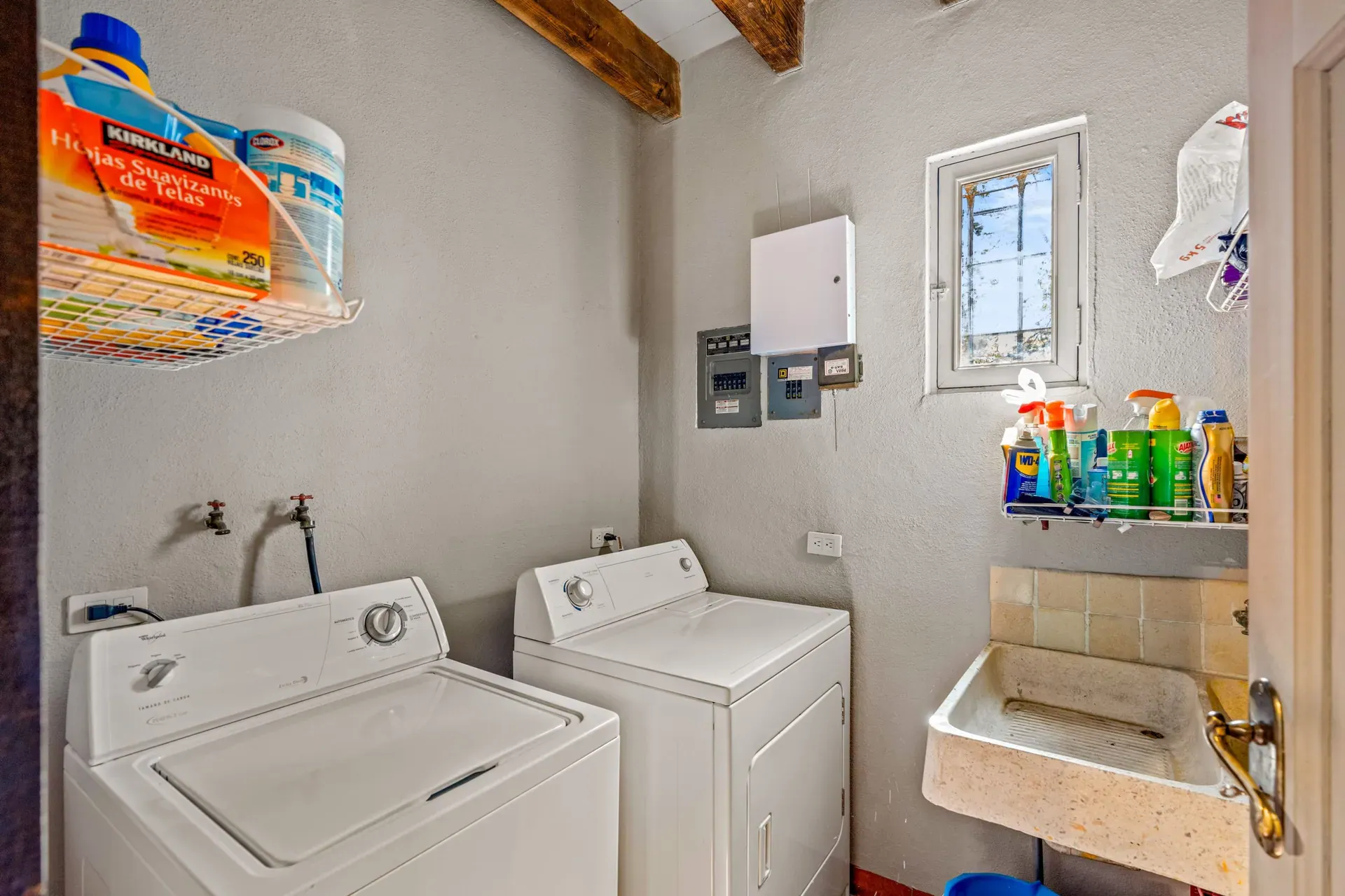Cuesta de San Jose 22, laundry room with a washer and dryer, a stone utility sink and a window, San Miguel de Allende