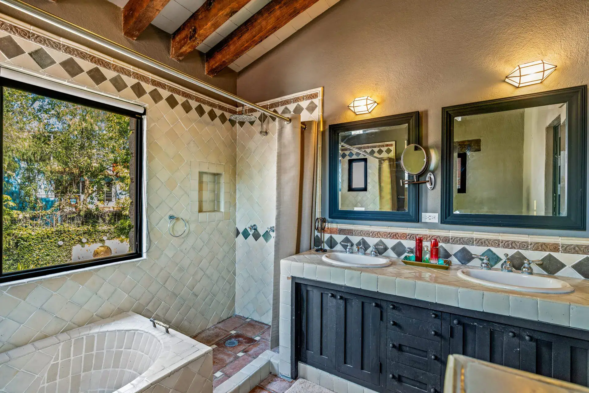 Cuesta de San Jose 22, bathroom with a double vanity, black mirrors, a large window, a tub and a tiled shower, San Miguel de Allende
