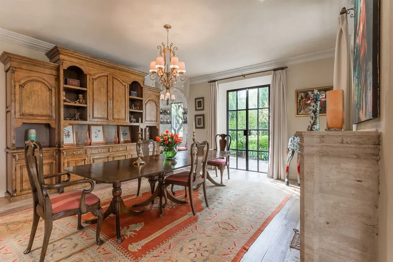 Finca Garambullos, dining room with a wood table and a china cabinet, San Miguel de Allende