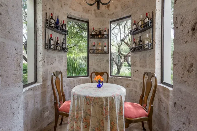 Finca Garambullos, wine nook with a round table and a stone tower, San Miguel de Allende