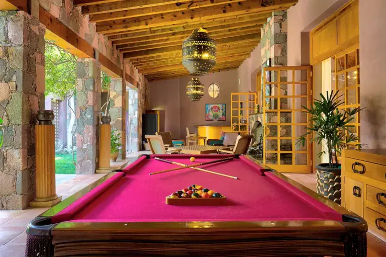 Hacienda Candelaria, game room with a pink billiard table and wood beam ceiling, San Miguel de Allende