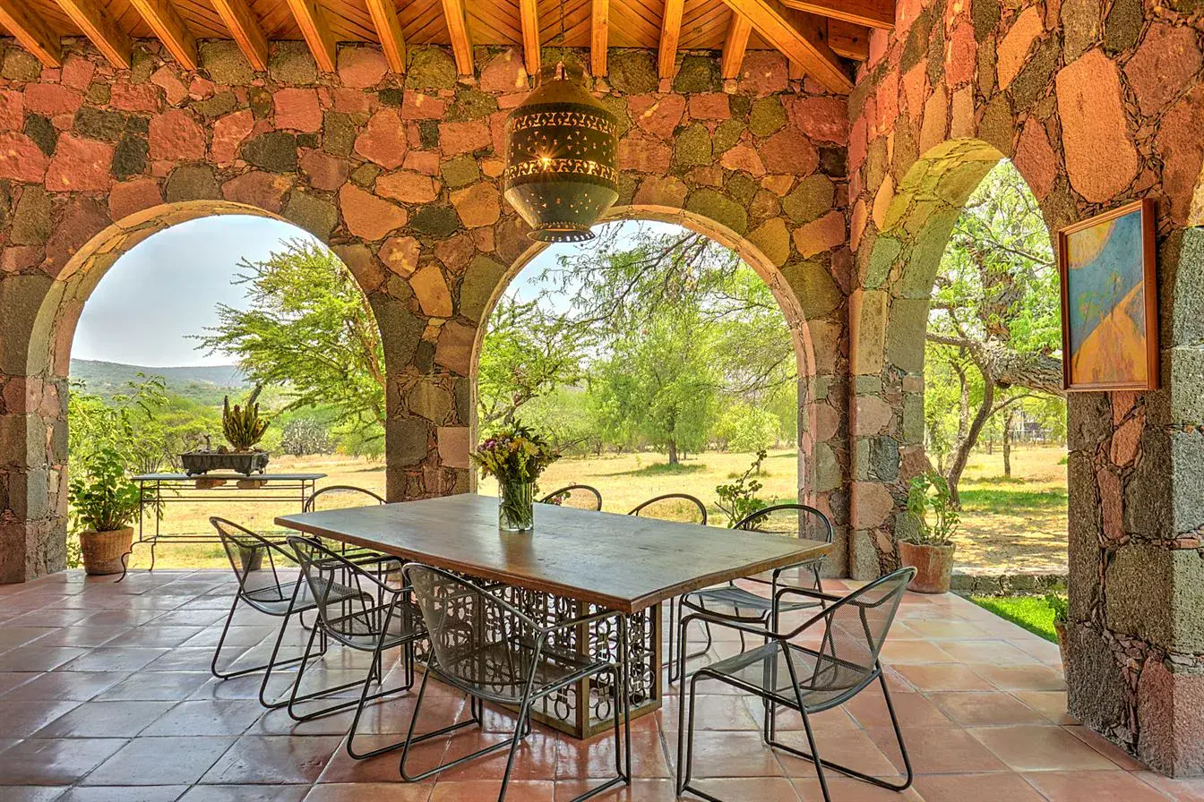 Hacienda Candelaria, stone arcade dining table with open views of the countryside, San Miguel de Allende