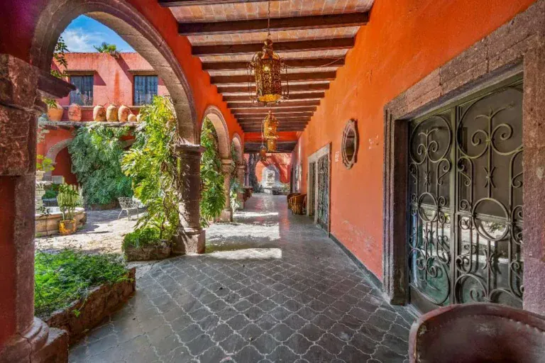 Hotel Casa Luna, arcade with wrought-iron doors opening onto the courtyard, San Miguel de Allende