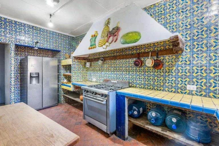 Hotel Casa Luna, kitchen with blue and yellow talavera tile and a gas range, San Miguel de Allende