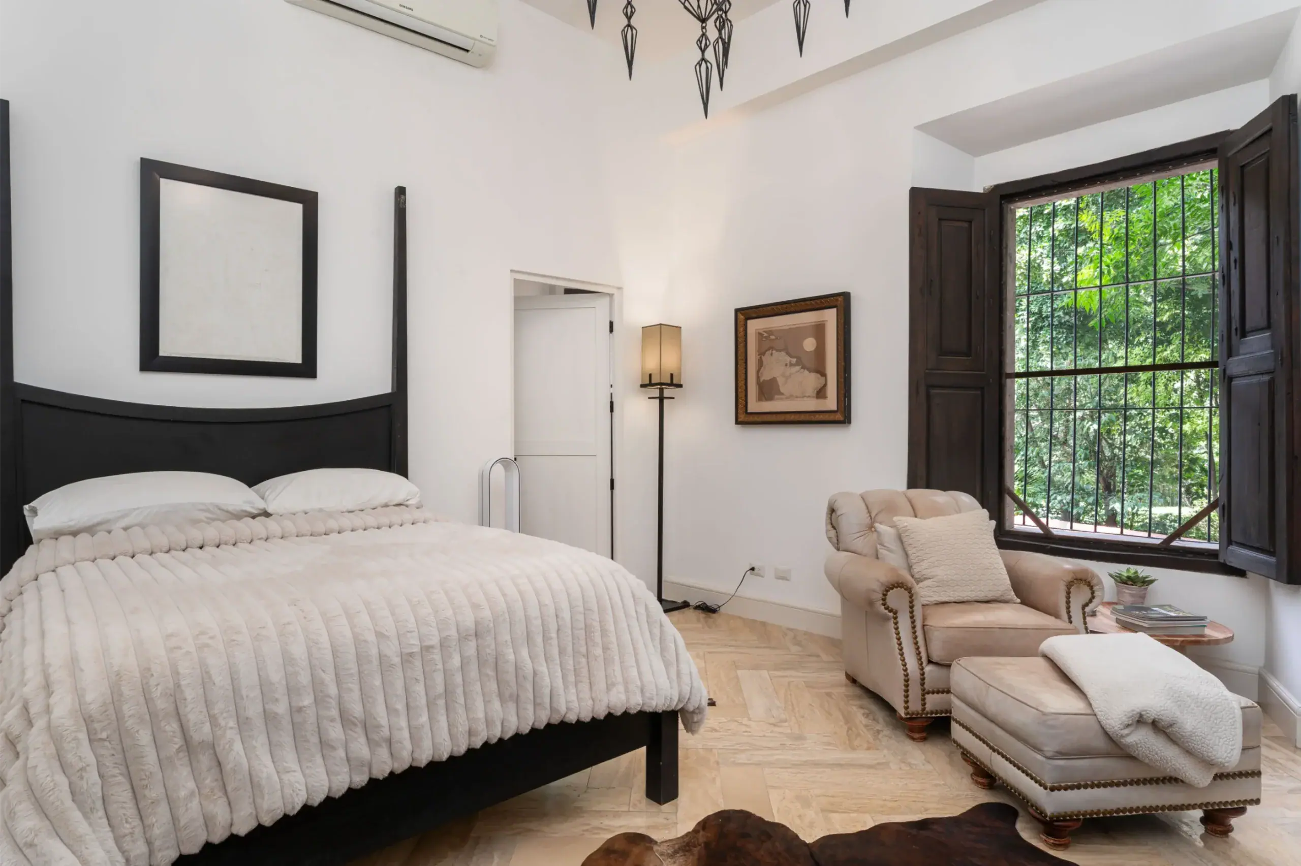 Casa Santa Mónica, bedroom with a four-poster bed and a shuttered window, San Miguel de Allende