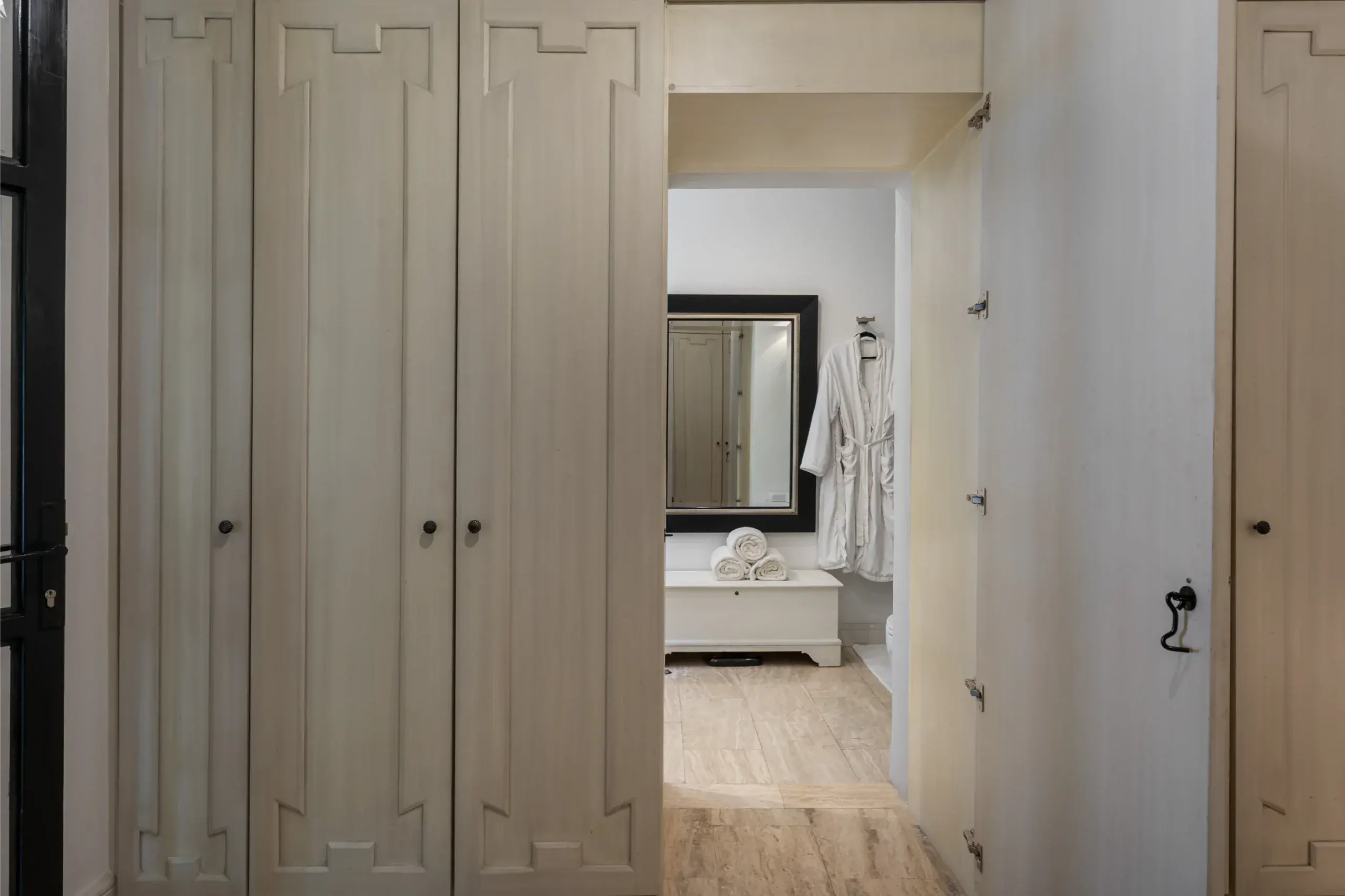 Casa Santa Mónica, closet doors opening to a bathroom, San Miguel de Allende