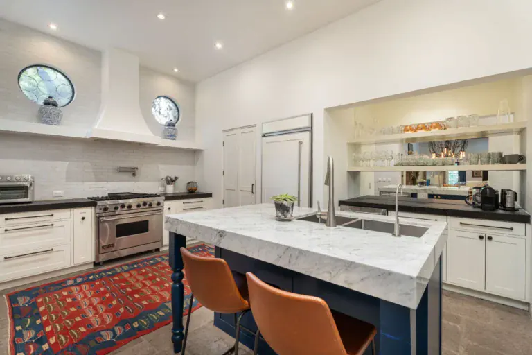 Casa Santa Mónica, kitchen with a marble island, blue base and a six-burner range, San Miguel de Allende
