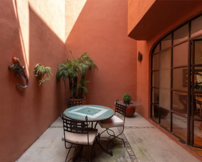 Casa Brillante, terracotta patio with a mosaic table and chairs, San Miguel de Allende