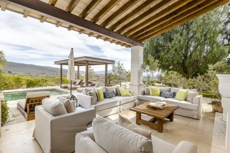 Mañanitas Residence, covered lounge with white sofas beside the pool, San Miguel de Allende