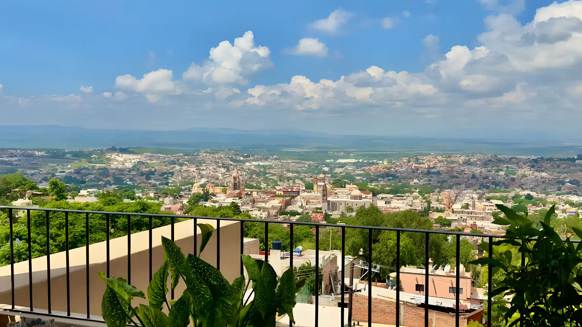 Raíz de las Nubes, terrace railing and a wide view over San Miguel de Allende and the surrounding valley