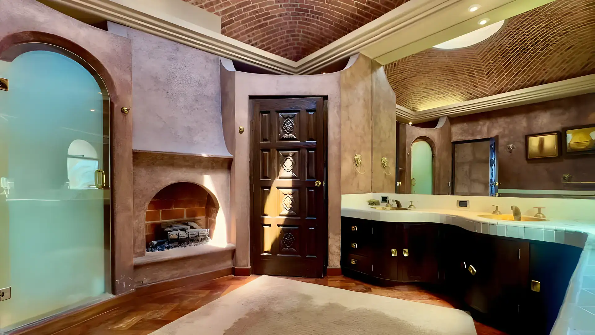 Raíz de las Nubes, bathroom with a dark double vanity, corner fireplace and an arched frosted glass door, San Miguel de Allende