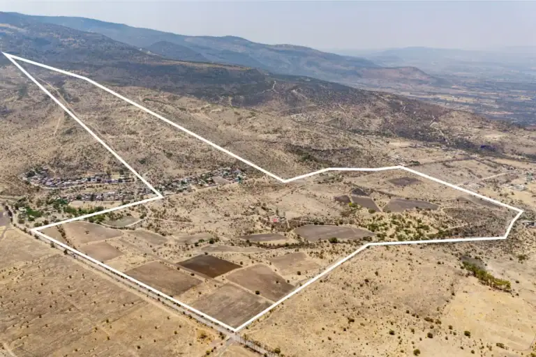 Rancho Guadalupe, aerial view of the parcel boundary outlined in white across plowed fields below the hills, San Miguel de Allende