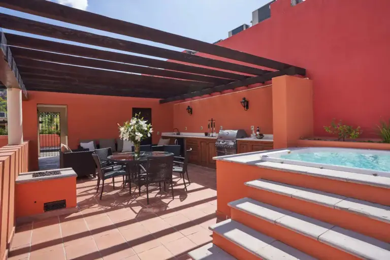 Rosewood Residence 7, terrace with an outdoor kitchen, dining set and a hot tub under a wood pergola, San Miguel de Allende