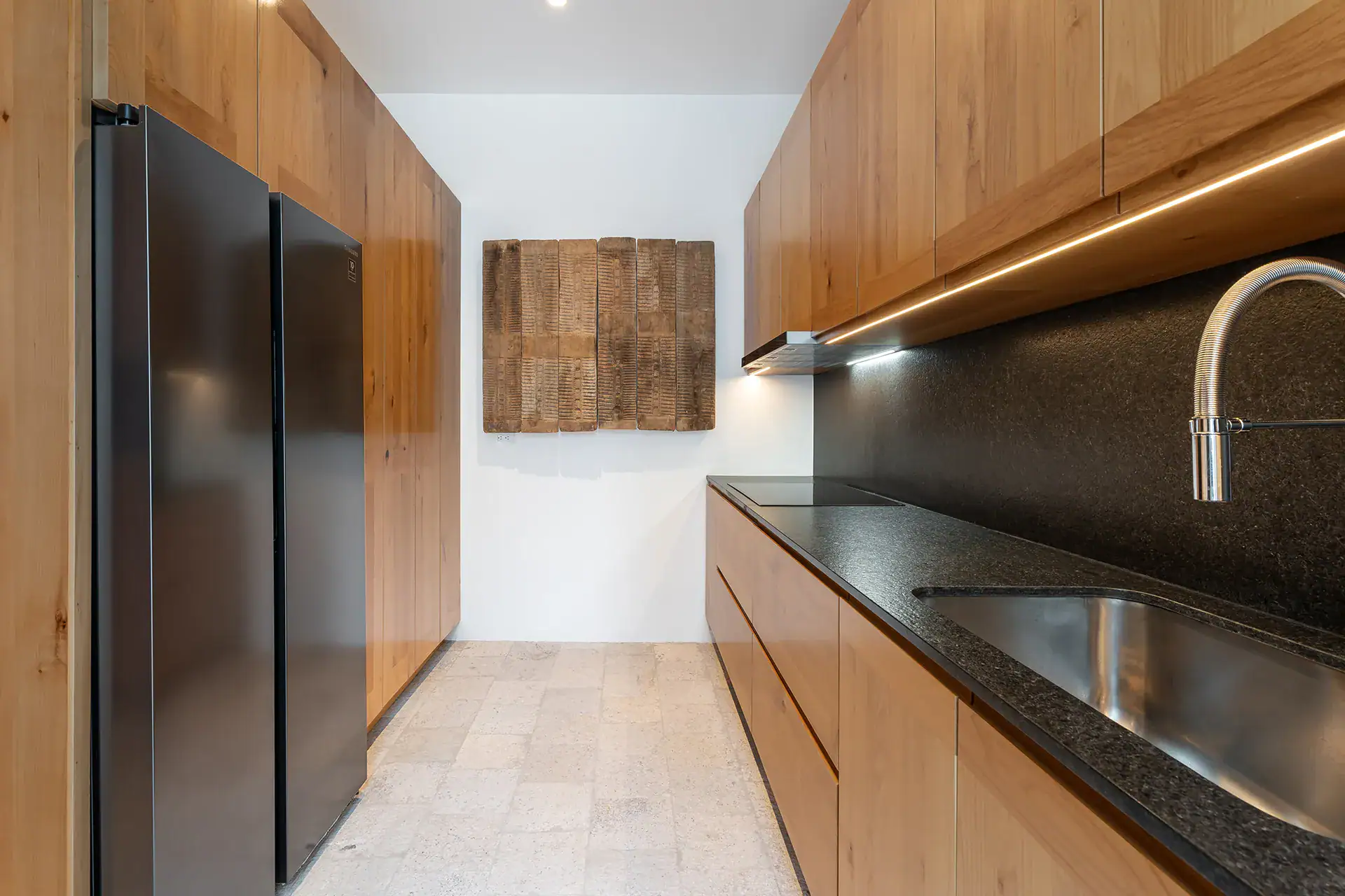Villa del Parque Central, kitchen with oak cabinets, black granite counter and stainless steel refrigerators, San Miguel de Allende