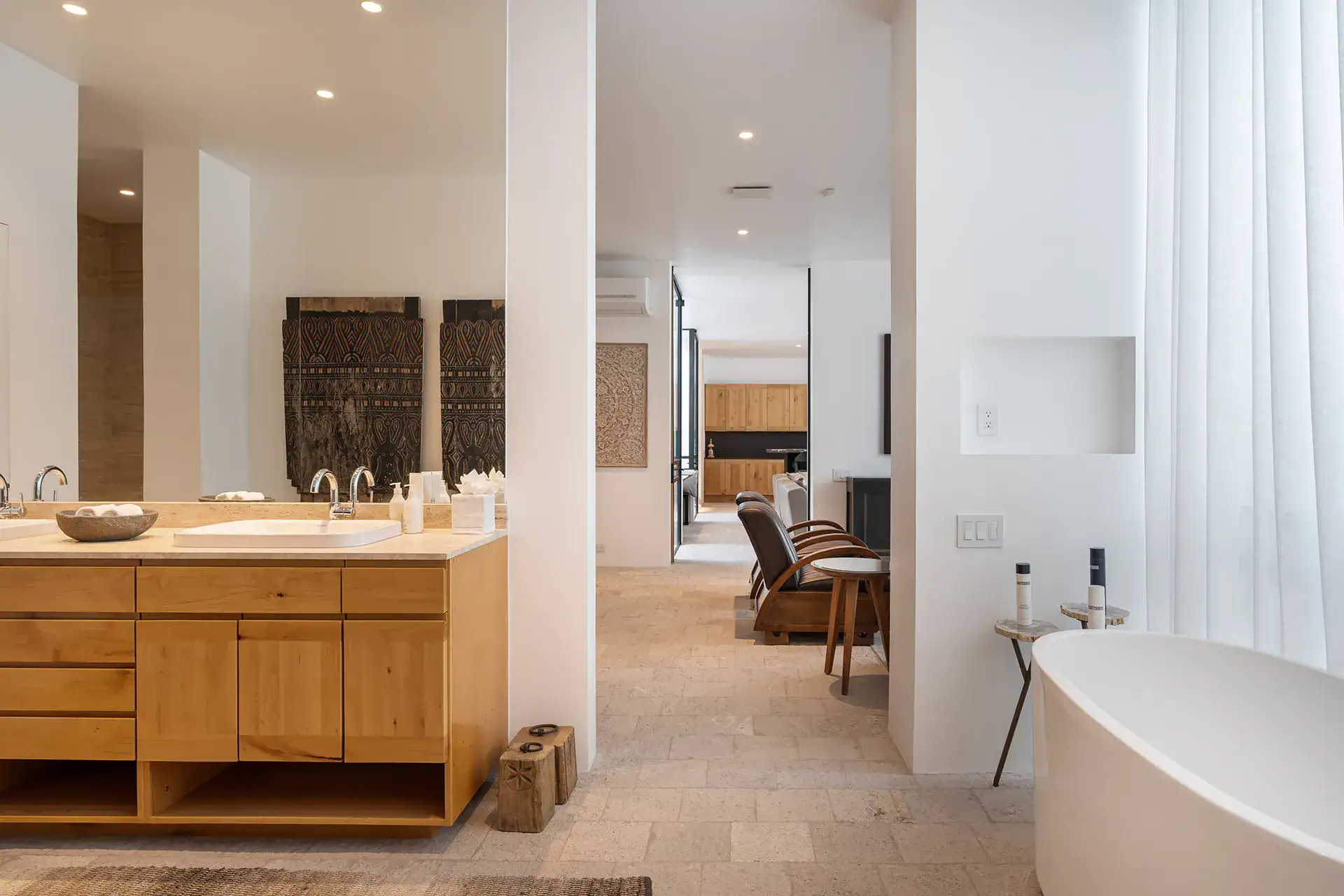 Villa del Parque Central, bathroom with an oak double vanity and freestanding tub looking toward the bedroom, San Miguel de Allende