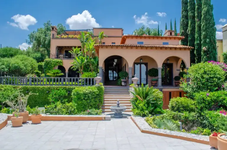 Villa Entre Sueños, Mediterranean-style facade with arches above a terraced garden, San Miguel de Allende