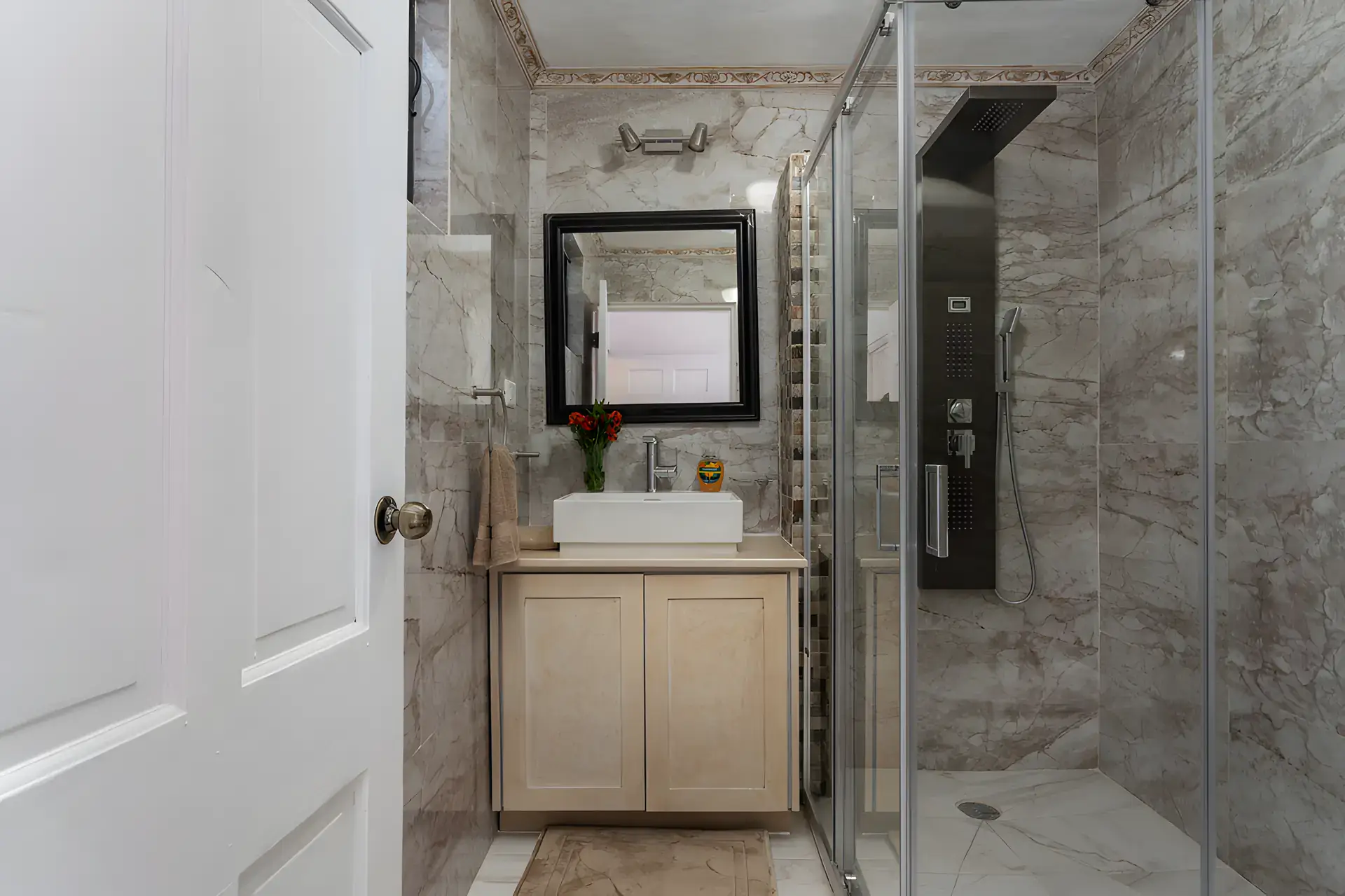 Villa Escondida, bathroom with a glass shower, shower panel and a vessel sink vanity, San Miguel de Allende