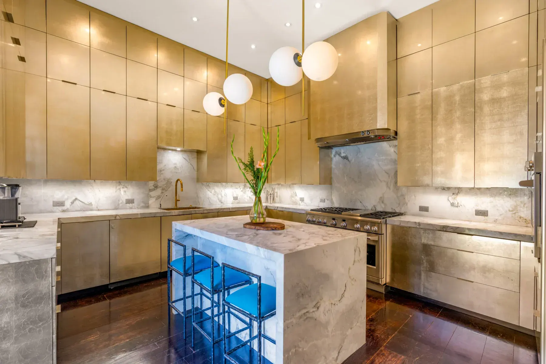 Villa Garita, kitchen with gold cabinets and a marble island, San Miguel de Allende
