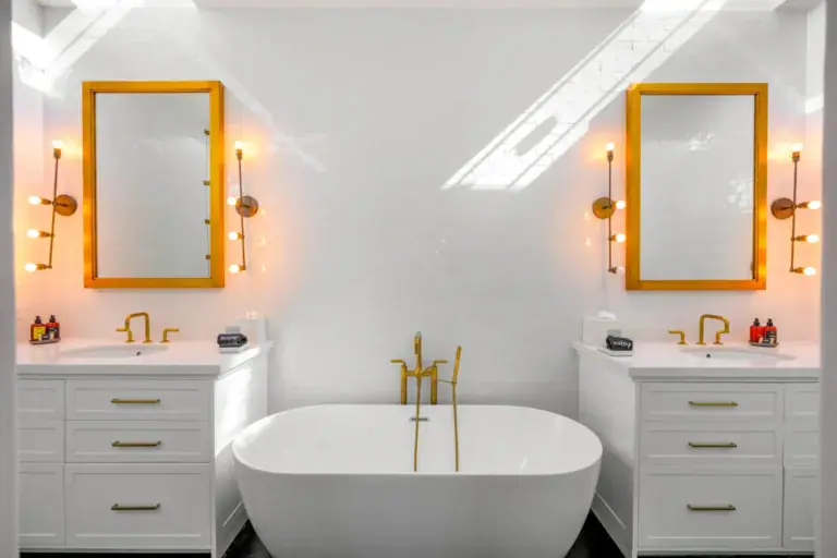 Villa Garita, bathroom with a freestanding tub, double vanity and gold mirrors, San Miguel de Allende