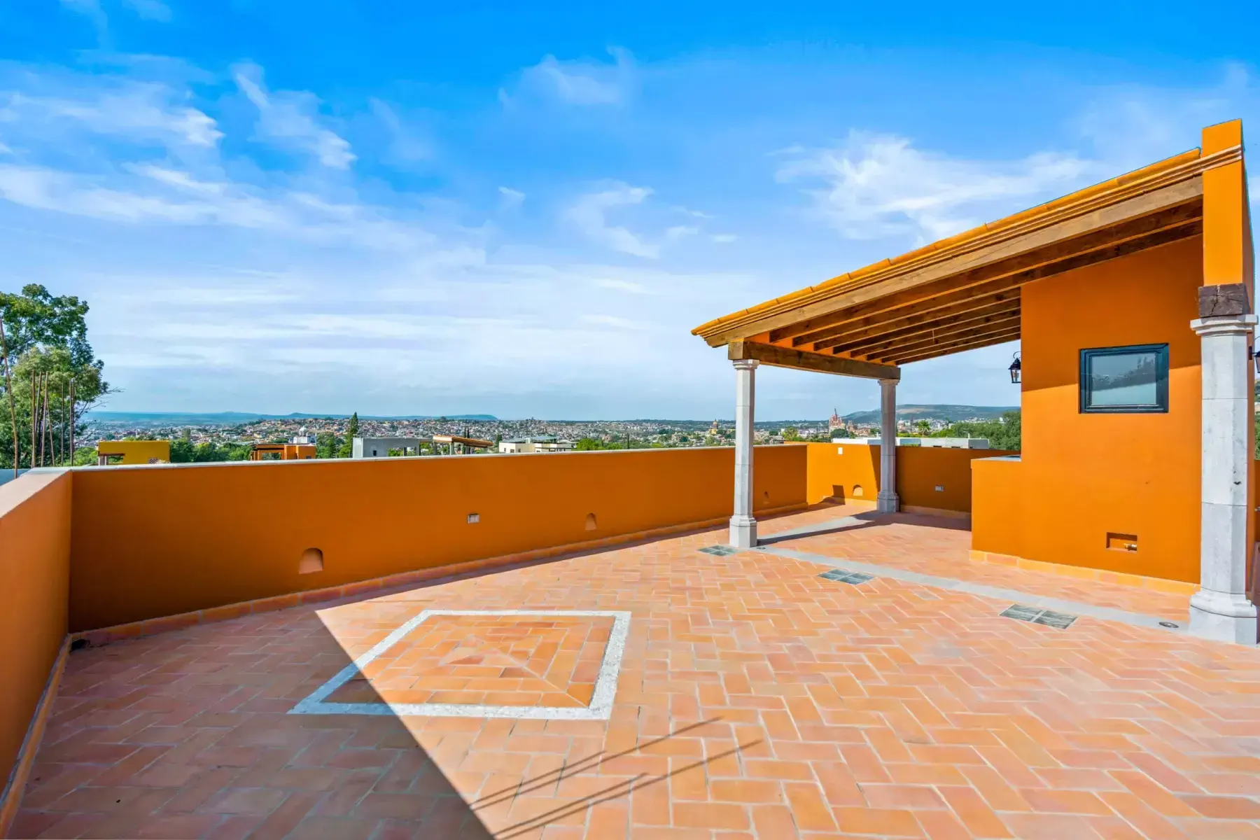 Villa Picasso, rooftop terrace with a wood pergola, a skylight panel and views of the hills, San Miguel de Allende