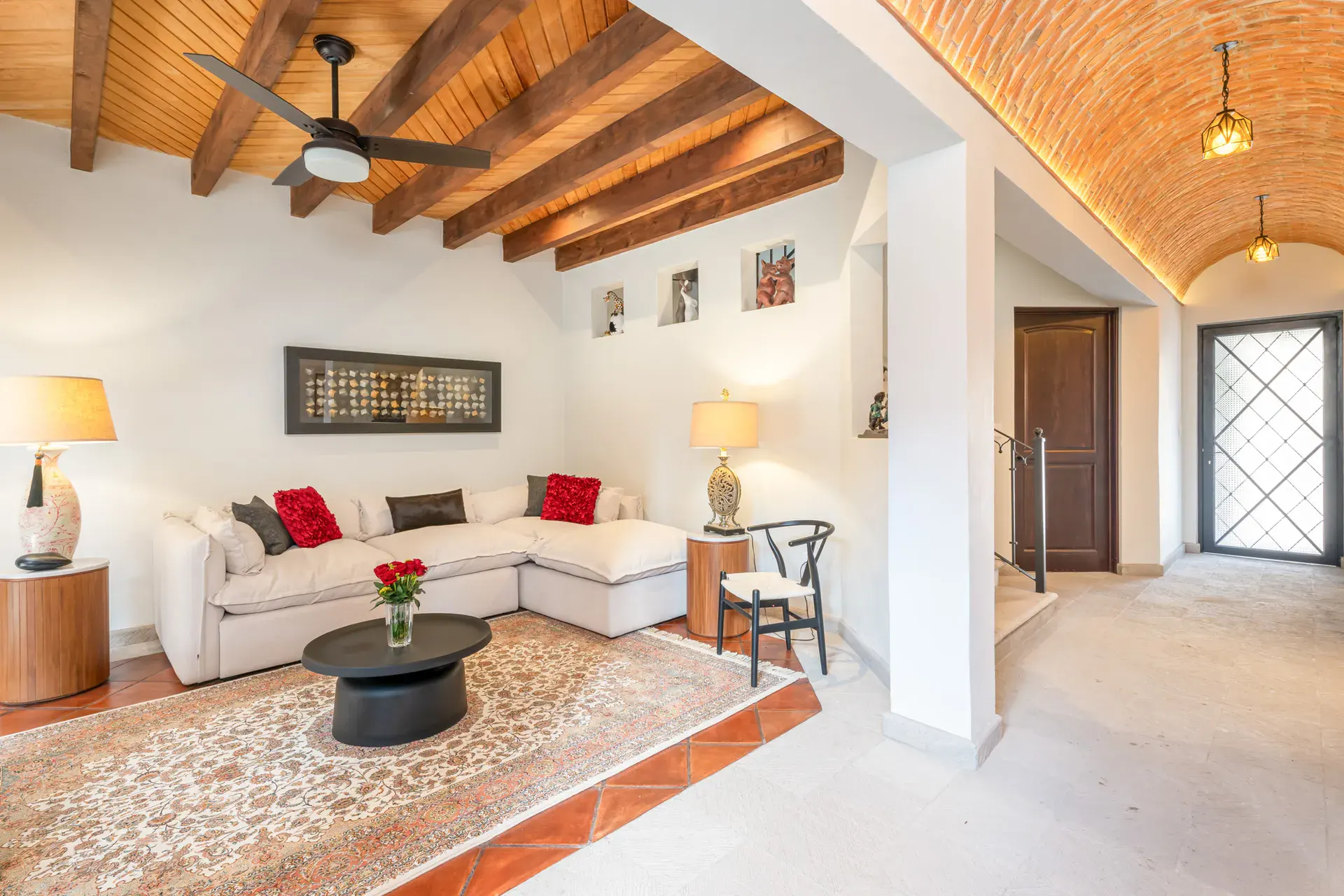 Villa Van Gogh, living room with a white sectional and a vaulted brick ceiling, San Miguel de Allende