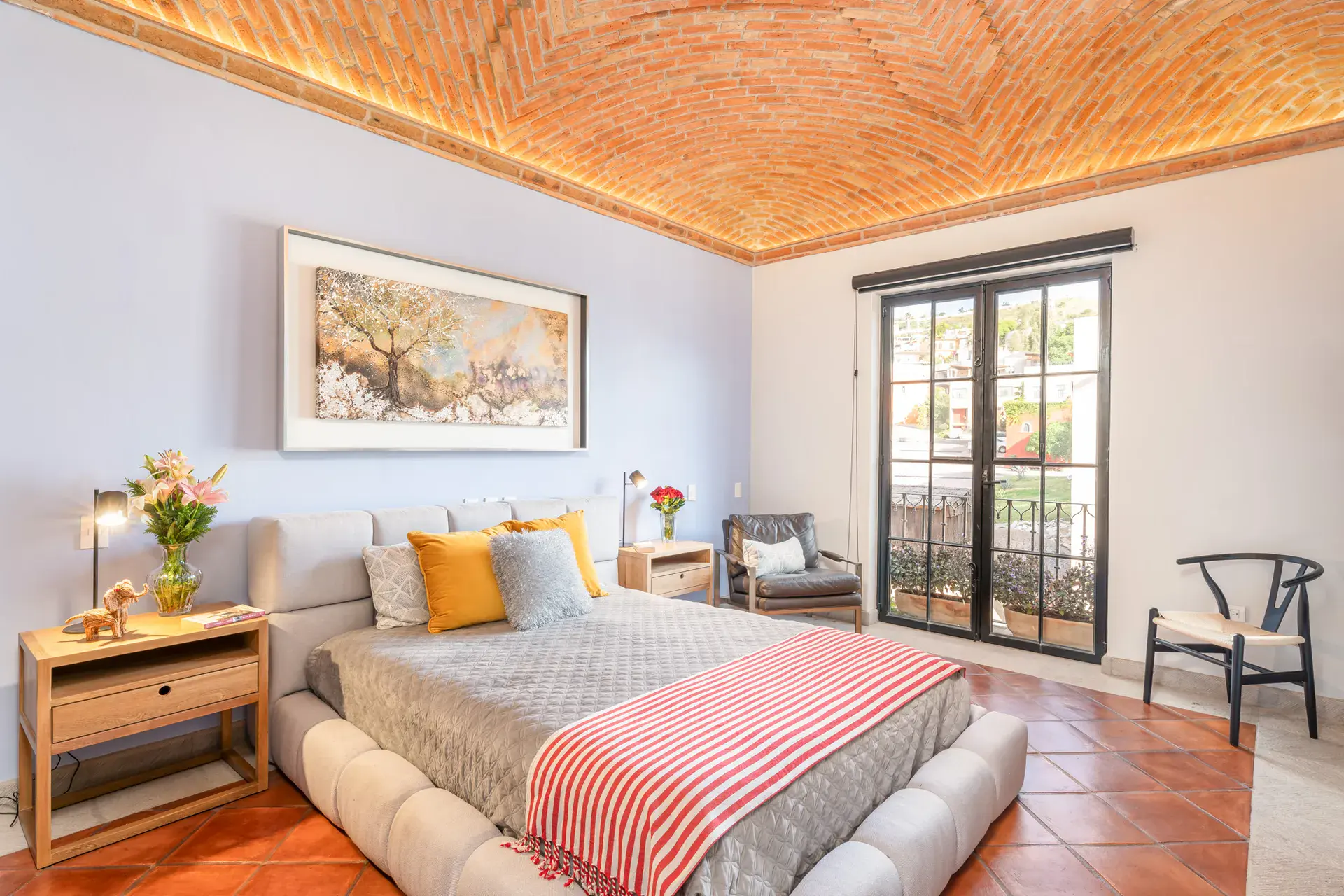 Villa Van Gogh, bedroom with a brick vaulted ceiling and garden doors, San Miguel de Allende